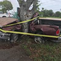 A man died when his pickup truck crashed into a tree in the Florida Keys during Hurricane Irma in Florida in this handout photo obtained by Reuters Sunday. Aircraft carrier rushed to Keys after Irma leaves isles devastated; storm blamed for five U.S. deaths