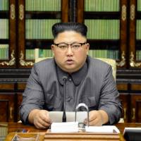 North Korean leader Kim Jong Un makes a statement regarding U.S. President Donald Trump’s speech at the U.N. general assembly, in this undated photo released Friday. Kim directly warns Trump as North Korean foreign minister says response may include Pacific H-bomb test