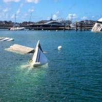 Boats and yatchs are seen sunk and damaged in a harbor on the French Caribbean island of St. Martin on Sunday, after the island was hit by Hurricane Irma. Almost two weeks after Irma slammed into St. Martin, killing 15 people, the French-Dutch Caribbean island has begun to take small steps toward reconstruction. Maria grows into hurricane as it aims at Irma-ravaged Caribbean isles as East Coast braces for Jose's surf