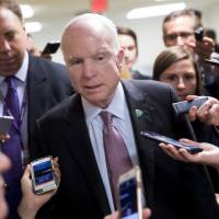 U.S. Sen. John McCain speaks to members of the media in the basement of the U.S. Capitol in Washington on Tuesday. McCain declares opposition to Republican Party's last-ditch efforts to kill 'Obamacare'