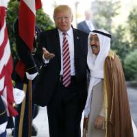 U.S. President Donald Trump gestures as he greets the Amir of Kuwait, Sheikh Sabah Al Ahmad Al Sabah, as he arrives at the White House in Washington on Sept. 7. Kuwait says it will expel North Korea’s ambassador and four other diplomats from its embassy in Kuwait City. Kuwait to expel North Korean ambassador and other diplomats
