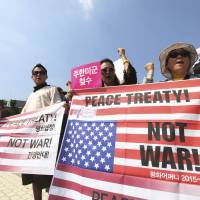 Protesters shout slogans during a rally against the deployment of the Terminal High-Altitude Area Defense (THAAD) missile-defense system, near the presidential Blue House in Seoul on Friday. After six decades of separation, the two Koreas are worlds apart