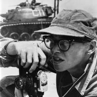 This 1958 photo provided by The United States Marine Corps shows photographer Dickey Chapelle taking photos on the shores of Lake Michigan during a U.S. Marines operation. Chapelle, originally from Wisconsin who’s believed to be the first female U.S. journalist killed in a war, has become an honorary Marine. She died in 1965 at the age of 47 while covering the Vietnam War when a Marine near her tripped a booby trap. Female photographer who covered Iwo Jima and Okinawa is named honorary Marine