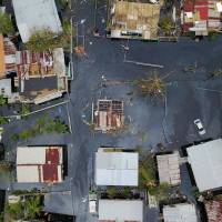 An aerial view shows the flooded neighborhood of Juana Matos in Catano, Puerto Rico, on Friday after Hurricane Maria ravaged the island. Hurricane Maria: 70,000 told to evacuate as dam fails in Puerto Rico