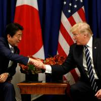 U.S. President Donald Trump meets with Prime Minister Shinzo Abe during the U.N. General Assembly in New York Thursday. Trump signs order for sanctions targeting any entities engaged in trade with North Korea