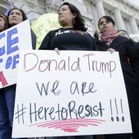 Demonstrators call on California to become a sanctuary state on Jan. 25 outside San Francisco City Hall. A bill is still in the works in the Legislature. The “ICE” in the sign refers to U.S. Immigration and Customs Enforcement. Judge: Sessions can't deny grant money for sanctuary cities