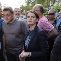 Serbian Prime Minister Ana Brnabic (center) is seen at the annual LGBT (lesbian, gay, bisexual and transgender) pride parade in Belgrade on Sunday. Serbia's openly gay prime minister attends pride march for first time