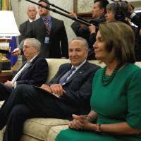 U.S. President Donald Trump meets with (from left) Senate Majority Leader Mitch McConnell, Senate Minority Leader Chuck Schumer, House Minority Leader Nancy Pelosi and other congressional leaders (unseen) in the Oval Office of the White House on Wednesday. Trump overrules GOP in deal with Democrats on spending, debt and Harvey aid