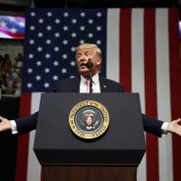 President Donald Trump speaks at a campaign rally for Sen. Luther Strange, R-Ala., in Huntsville, Alabama, Friday. Trump is expected to announce new restrictions on travel to the U.S. as his ban on visitors from six Muslim-majority countries sunsets Sunday, 90 days after it went into effect. Trump replaces 90-day ban with new travel restrictions