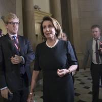 House Minority Leader Nancy Pelosi leaves a meeting with Speaker of the House Paul Ryan and members of the Congressional Hispanic Caucus at the Capitol in Washington Wednesday. The top House and Senate Democrats have announced agreement with President Donald Trump to protect certain immigrants brought illegally to this country as children — along with some border security enhancements. The agreement was announced in a joint statement from Pelosi and Senate Minority Leader Chuck Schumer of New York, following a dinner the pair had with Trump at the White House. Trump wooing Democrats with Dreamer, tax-the-rich overtures as GOP allies in Congress fail to deliver
