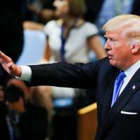 U.S. President Donald Trump greets delegates after addressing the 72nd United Nations General Assembly at U.N. headquarters in New York Tuesday. Trump seen tapping campaign, RNC funds to pay legal bills from Russia probe