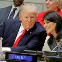 U.S. President Donald Trump talks with U.S. Ambassador to the U.N. Nikki Haley as they attend a session on reforming the United Nations at U.N. Headquarters in New York Monday. Trump tempers U.N. criticism at debut but calls for reform of 'mismanaged' world body