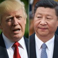 This combination of file photos created on Monday shows U.S. President Donald Trump speaking about Hurricane Irma upon in Washington on Sept. 10 and Chinese President Xi Jinping during a Sept. 13 welcome ceremony outside the Great Hall of the People for Sultan of Brunei Hassanal Bolkiah (not seen) in Beijing. Trump, Xi agree on ‘maximizing pressure’ on North Korea: White House