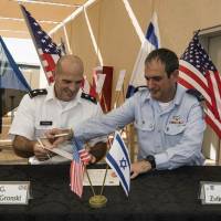 Israeli Defense Forces Brig. Gen. Zvika Haimovich (right) and U.S. Maj. Gen. John L. Gronski sign an agreement during a ceremony at the Bislach Air Base, near Mitzpe Ramon, Israel, Monday. Israel and the United States announced plans Monday to open the first American air base in the Jewish state — a facility that will aim to bolster Israel’s aerial defenses. U.S. opens first joint-use military base in Israel, mainly focused on missile defenses