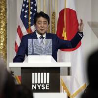 Prime Minister Shinzo Abe delivers a speech on Japan’s economy and investment-friendly reforms at the New York Stock Exchange on Wednesday. Abe calls for shift of social security benefits to working generation