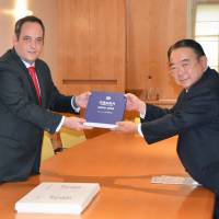 Japanese Ambassador to France Masato Kitera submits Osaka’s bid to host the 2025 world exposition to the Bureau International des Expositions in Paris on Monday. Japan submits Osaka's bid to host 2025 world expo
