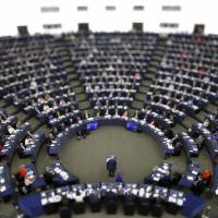 In this image made with a tilt-shift lens, European Commission President Jean-Claude Juncker addresses the members of the European Parliament in Strasbourg, eastern France, to outline his reform plans for the European Union in the so-called State of the Union debate Wednesday. EU parliament opposes bid to reduce testing of Fukushima food imports