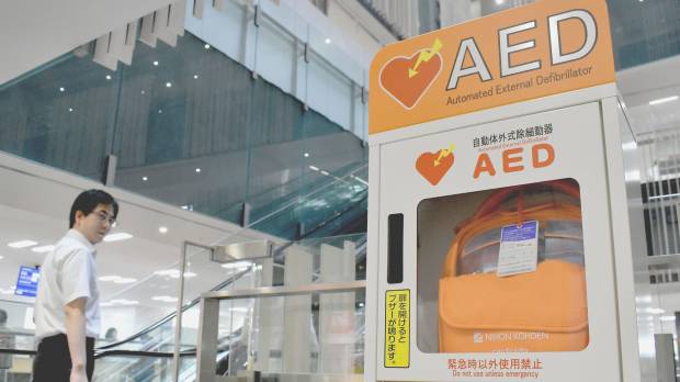 An automated external defibrillator (AED) is seen inside the Toshima Ward Office in Tokyo. Experts say a quick response, including cardiac massage and administering an electric shock via an AED, is crucial to save the life of someone who has had a heart attack. Saving heart attack victims? Now there's an app for that