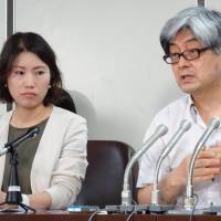 Lawyers Ayane Odagawa and Shogo Watanabe, members of Japan Lawyers Network for Refugees, speak at a news conference Tuesday at the Tokyo District Court. Lawyers' group petitions ministry to improve attitudes of refugee counselors following alleged inappropriate remark