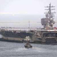 The aircraft carrier USS Ronald Reagan leaves its home port in Yokosuka, Kanagawa Prefecture, on Friday. Japan-based U.S. carrier leaves Yokosuka on surveillance mission amid North Korea tensions