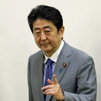 Prime Minister Shinzo Abe arrives for an U.N. event in New York on Monday. Abe eyes tax revenue for child-rearing support in election platform