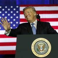U.S. President Donald Trump waves before speaking in Indianapolis on Wednesday. North Korea in spotlight as Trump announces visit to Japan, four other Asian nations in November