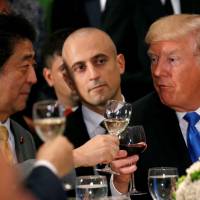 U.S. President Donald Trump and Prime Minister Shinzo Abe toast during a luncheon hosted by the United Nations secretary-general in New York on Tuesday. Trump's fire and brimstone U.N. speech hands Abe a win on North Korea, but will victory be pyrrhic?