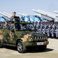 Chinese President Xi Jinping inspects People’s Liberation Army troops during a military parade to commemorate the 90th anniversary of the founding of the PLA on July 30. China's troublesome civil-military relations