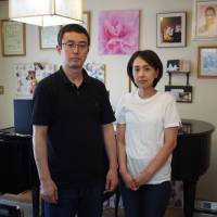 Junko and Takanobu Nakashima stand in front of Naoko’s grand piano in August. Confronting youth suicide: Seeking ways to stop young people from taking their own lives