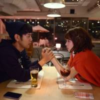 Love struck: Satoshi Tsumabuki’s Koroki (left) falls for Kiko Mizuhara’s Akari in Hitoshi One’s latest. 'Okuda Tamio ni Naritai Boi to Deau Otoko Subete Kuruwaseru Garu': A bumbling Romeo falls into love