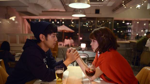 Love struck: Satoshi Tsumabuki’s Koroki (left) falls for Kiko Mizuhara’s Akari in Hitoshi One’s latest. 'Okuda Tamio ni Naritai Boi to Deau Otoko Subete Kuruwaseru Garu': A bumbling Romeo falls into love