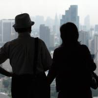 An elderly couple views Tokyo’s skyline. Approximately one out of four Japanese is now 65 or older. By 2060, 40 percent of Japan’s population will fall into this age bracket. A silver-lining for graying Japan