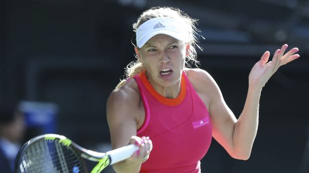 Caroline Wozniacki plays a shot from Garbine Muguruza in their semifinal match on Saturday at the Toray Pan Pacific Open at Ariake Colosseum. Wozniacki won 6-2, 6-0. Wozniacki storms into final