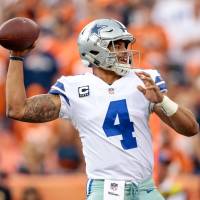 Cowboys quarterback Dak Prescott looks to pass during Dallas’ game against the Broncos on Sunday in Denver. Cowboys named world's most valuable team at $4.8 billion