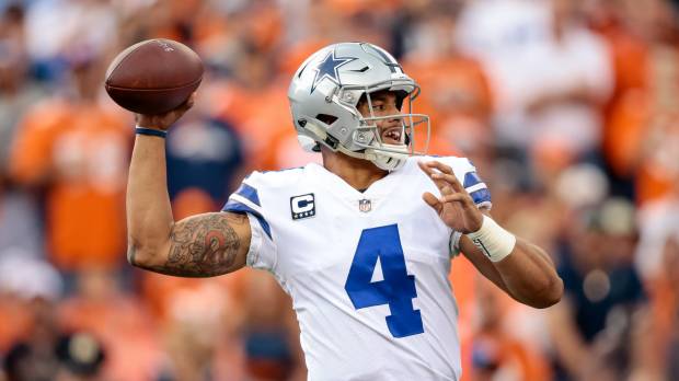 Cowboys quarterback Dak Prescott looks to pass during Dallas’ game against the Broncos on Sunday in Denver. Cowboys named world's most valuable team at $4.8 billion