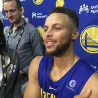 Warriors guard Stephen Curry speaks to the media after practice on Saturday in Oakland, California. Trump inflames sports world with comments about anthem, Curry