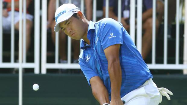 Hideki Matsuyama hits an approach on the ninth hole during the final round of the Tour Championship on Sunday in Atlanta. Matsuyama 26th at East Lake; Schauffele, Thomas win big