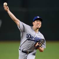 Los Angeles starter Kenta Maeda fires a pitch against Arizona in the first inning on Thursday night. D-Backs pound Maeda, slumping Dodgers