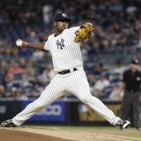 New York’s Luis Severino pitches against Baltimore in the first inning on Friday night. Girardi gets 900th win with Yanks