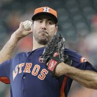 Astros starter Justin Verlander pitches against the Mariners on Sunday in Houston. The Astros won 7-1 to clinch the AL West division. Verlander shines as Astros clinch AL West