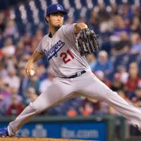 Los Angeles starting pitcher Yu Darvish delivers during the Dodgers’ 6-2 loss to the Phillies on Tuesday in Philadelphia. Darvish reaches 200 strikeouts but fails to get 10th win