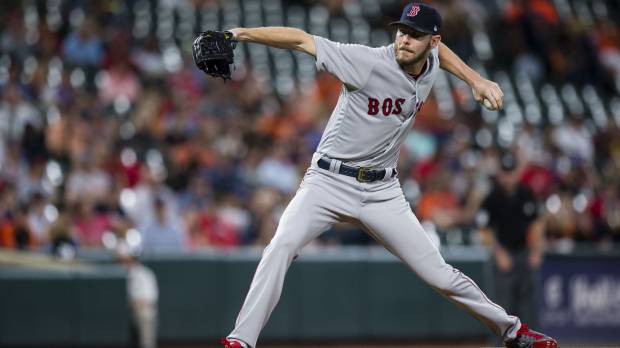 Boston’s Chris Sale pitches during the first inning of the Red Sox’s 9-0 win over the Orioles in Baltimore on Wednesday. Sale reaches 300 strikeouts as Red Sox clinch playoff berth