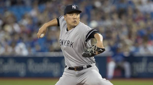 New York starter Masahiro Tanaka pitches against Toronto in the first inning on Friday night. Blue Jays pounce on Tanaka