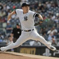 New York starter Masahiro Tanaka pitches against Toronto in the first inning on Friday at Yankee Stadium. Tanaka baffles Jays with 15 Ks
