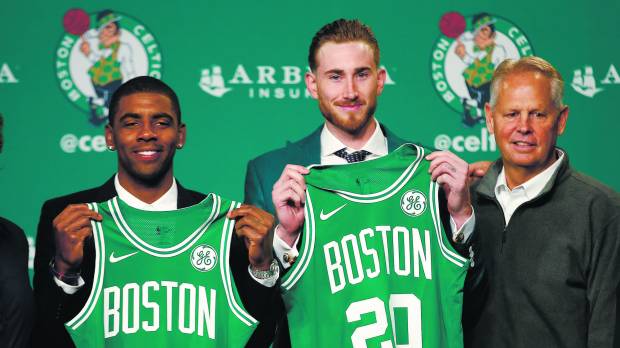 New Celtics players Kyrie Irving (left) and Gordon Hayward (center) pose with general manager Danny Ainge during a news conference in Boston, on Sept. 1. Irving not concerned about Lebron's feelings