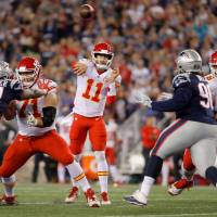 Kansas City QB Alex Smith passes against New England in the NFL season opener on Thursday night. Chiefs stick it to Patriots in opener