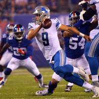 Lions quarterback Matthew Stafford scrambles during Detroit’s game against the Giants on Monday in East Rutherford, New Jersey. The Lions won 24-10. Lions dominate from start, cruise past Giants