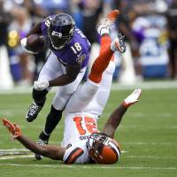 Ravens receiver Jeremy Maclin upends Browns cornerback Jamar Taylor during the first half on Monday in Baltimore. The Ravens will face the Jaguars in London on Sunday. Ravens to take show on road with game in London on tap