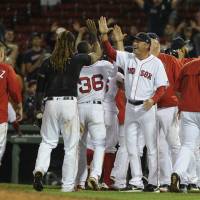 The Red Sox, seen celebrating a win over the Blue Jays on Tuesday night, have been accused of using an Apple Watch to steal signs. Red Sox admit to using Apple Watch to steal Yankees' signs