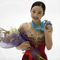 Marin Honda poses with her medal after winning the U.S. International Figure Skating Classic on Saturday in Salt Lake City. Honda golden in senior circuit debut